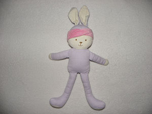 Doudou Lapin Blanc corps mauve bandeau rose Corolle